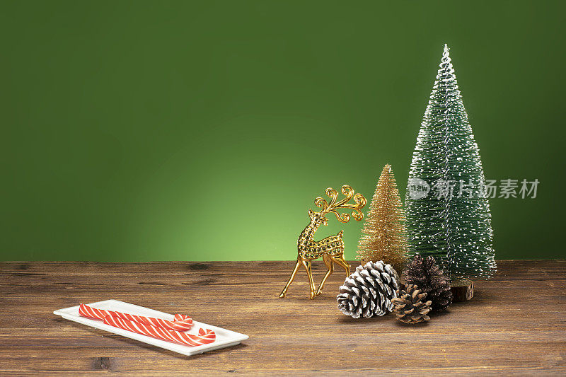 CHRİSTMAS ORNAMENTS with decoration on GREEN background.